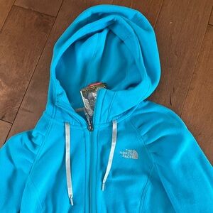 Blue fleece north face zip up hoodie